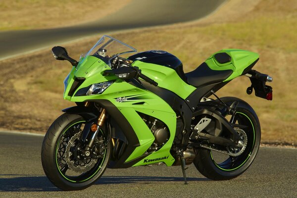 Sporty green motorbike on the track