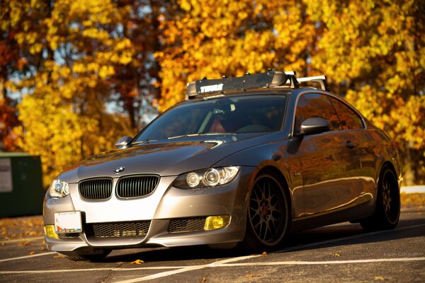 Car in the parking lot at the yellow trees