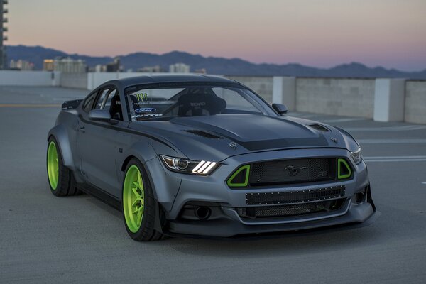 Ford Mustang gray in the parking lot