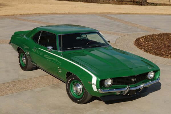 Classic green car on the highway