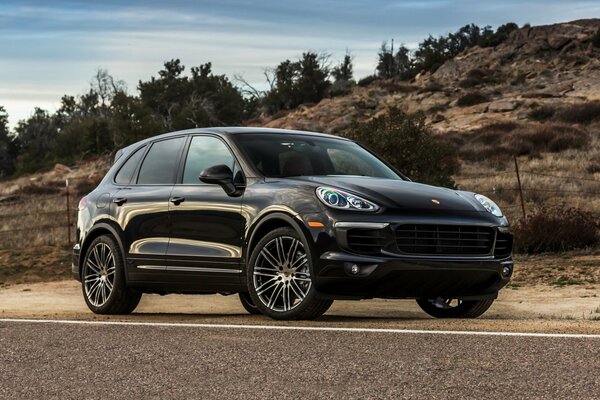 The powerful, black Porsche Cayenne is designed for travel