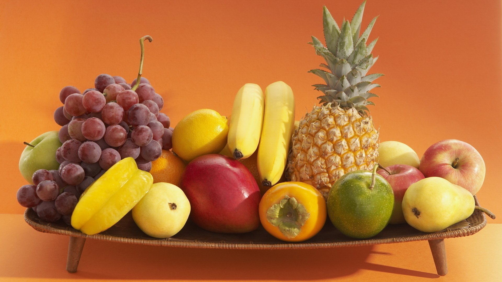 food fruit orange background stand pineapple persimmon grapes bananas carambola apples mangoes oranges assorted fruit