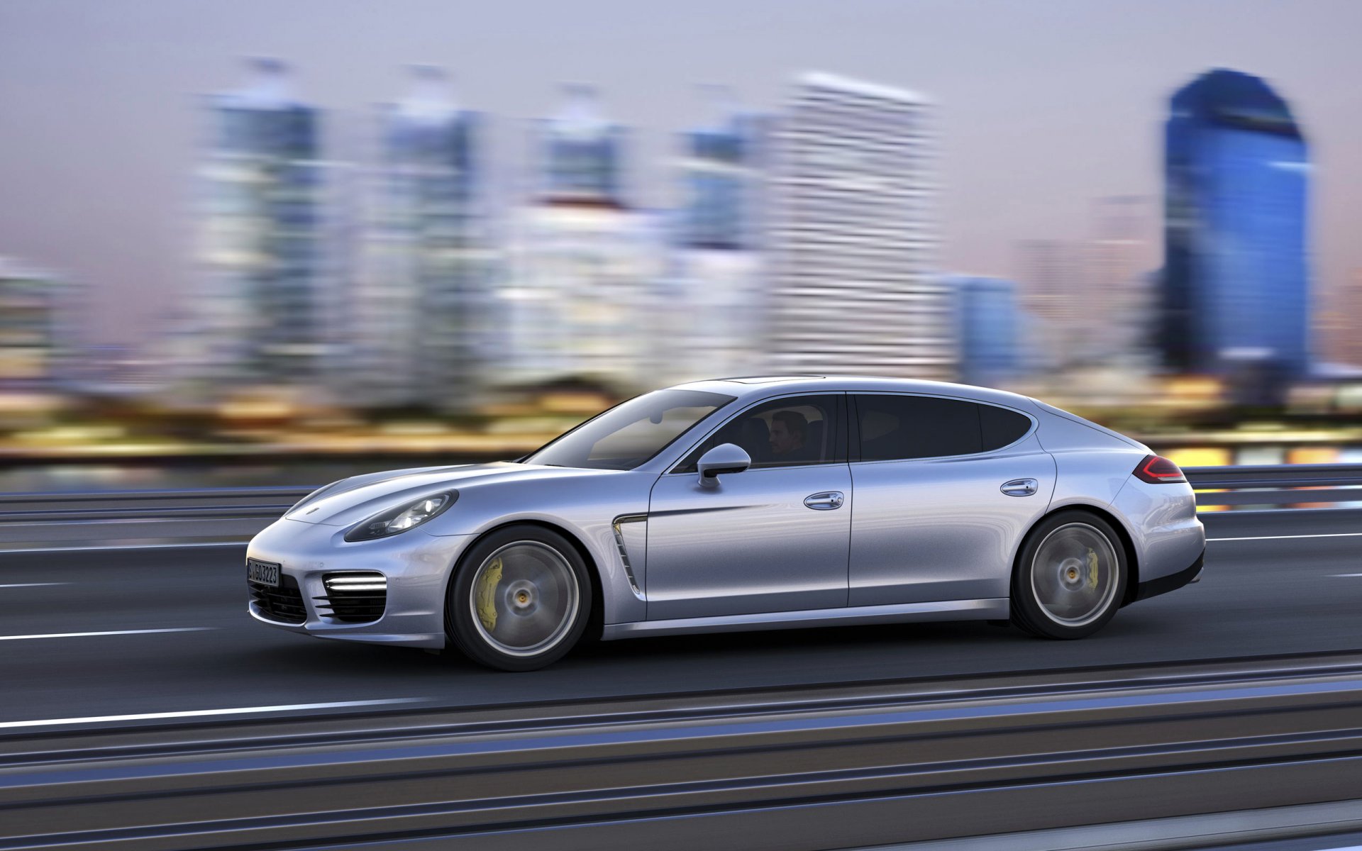 porsche panamera auto macchina grigio in movimento vista laterale città berlina