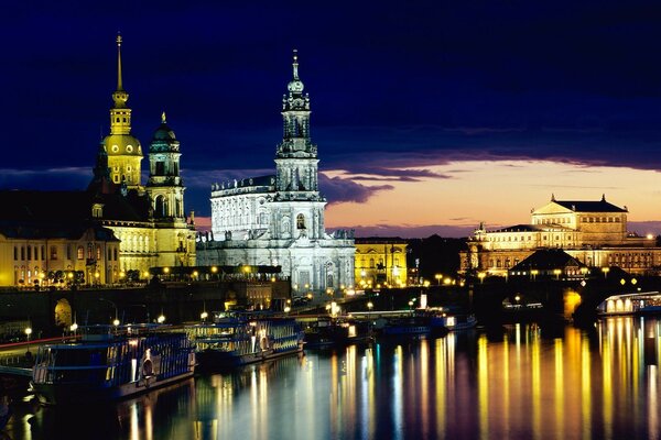 Lanterns are reflected in the River Elbe in the city of Dresden