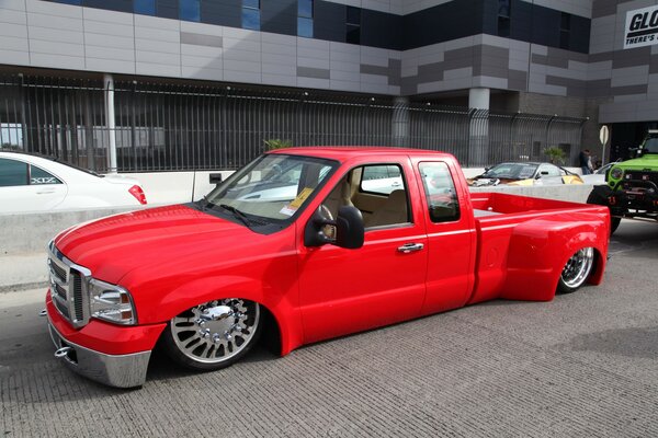 Red pickup truck with a low landing