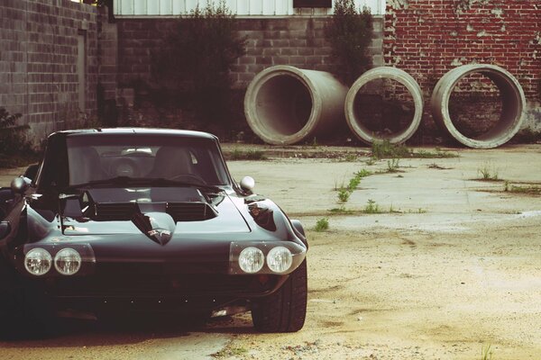 Black Chevrolet Corvette. Factory yard