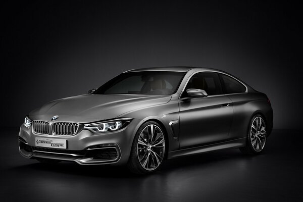 Silver BMW 4-5 series on a dark background