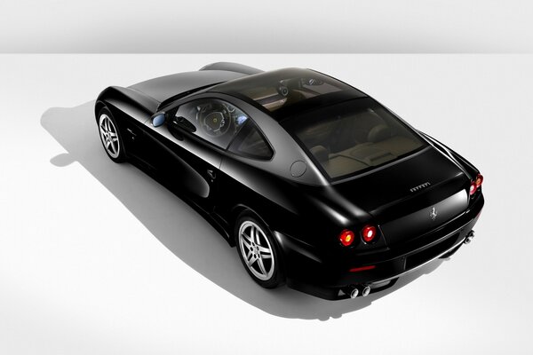 Black Ferrari 612 car on a white background