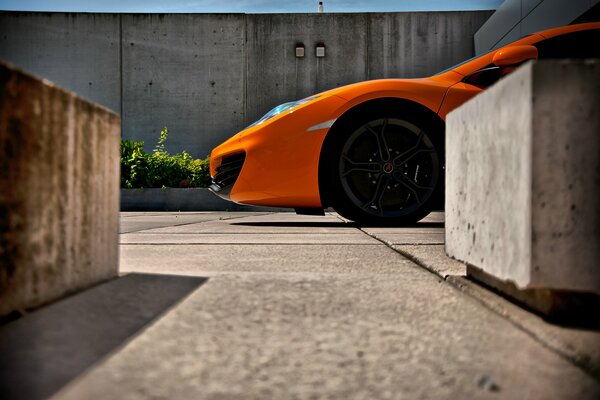 Orange mclaren cunningly taxied around the corner