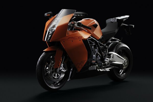High-speed orange moto on a dark background