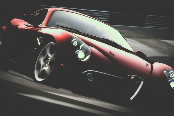 Red car driving on the highway