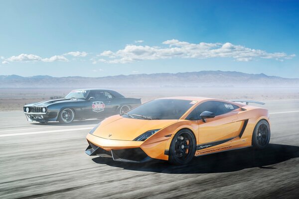 Orange Lamborghini gallardo and black Camaro