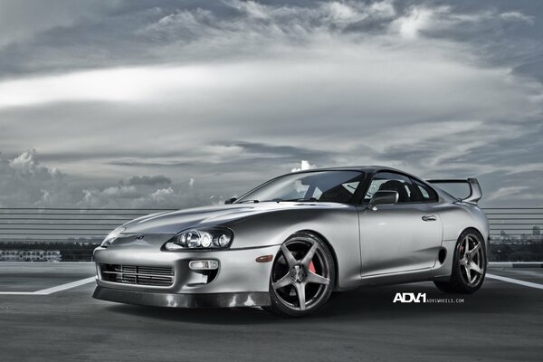 Silver Toyota Supra at the stadium