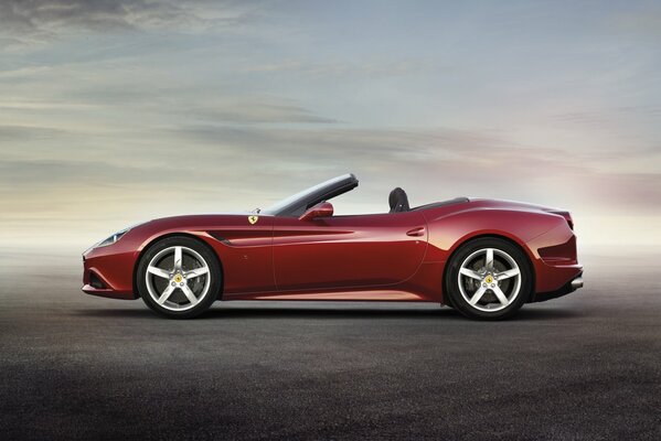 Side view of a red Ferrari convertible
