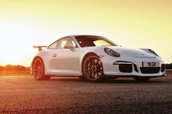 Porsche 911 on the background of the evening sun