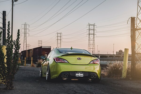 Industrial landscape with green hyundai genesis