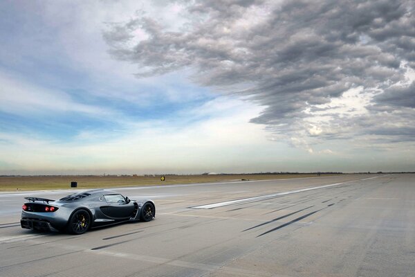 A car on the runway with beautiful lines