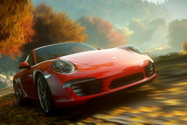 A red Porsche car on the background of an autumn landscape