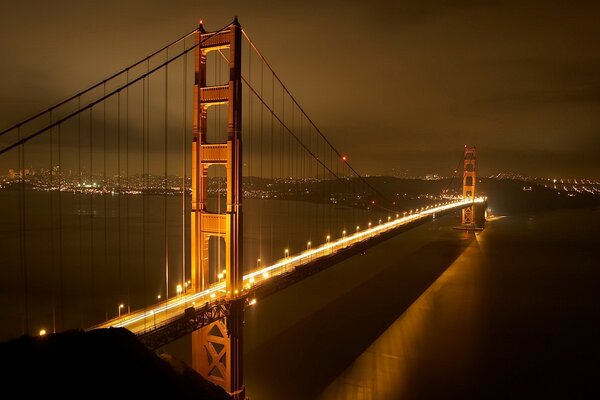 Night bridge in the light of lanterns