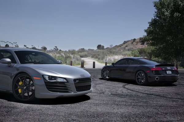 Grey and black car on the road