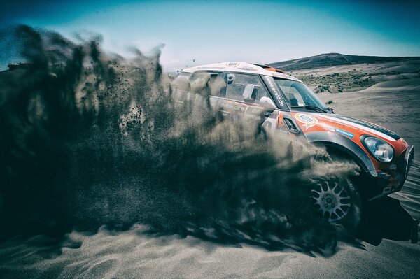 The SUV is flying along the road in the desert