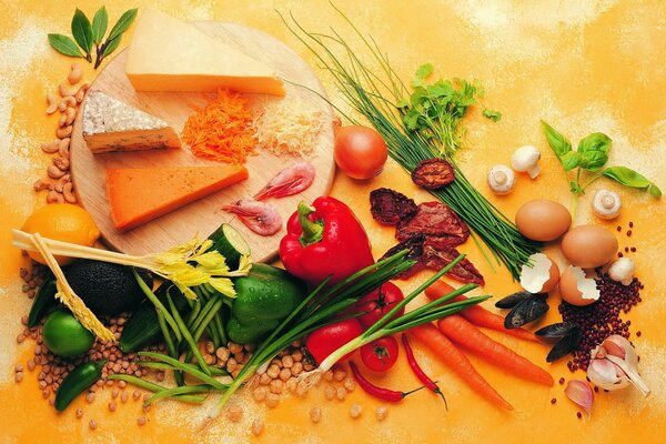 Cheese plate with vegetables and herbs