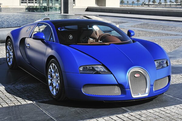 Bugatti supercar on a sunny day near the building