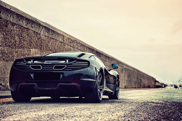 Sports car on the background of a concrete wall