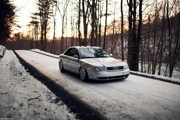 Silver Audi A4 Snow Forest road