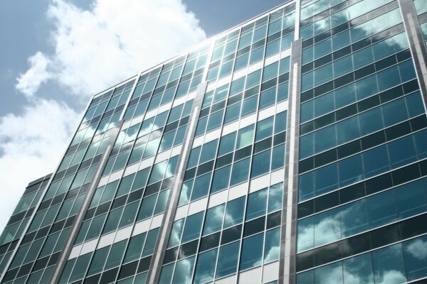 Reflection of clouds in the glass of a skyscraper