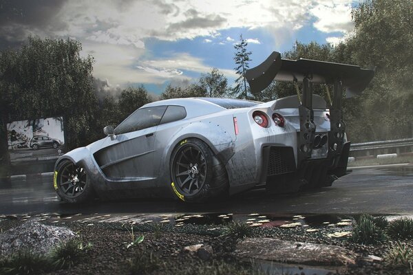 Grey Nissan GTR with high spoiler on the road against the sky