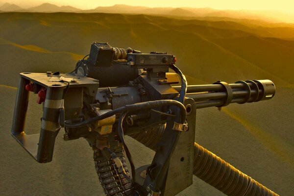 Weapons from a helicopter at sunset