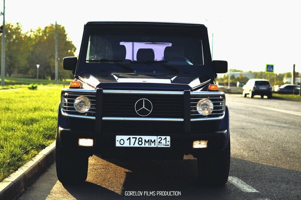 Black Mercedes Benz car on the road