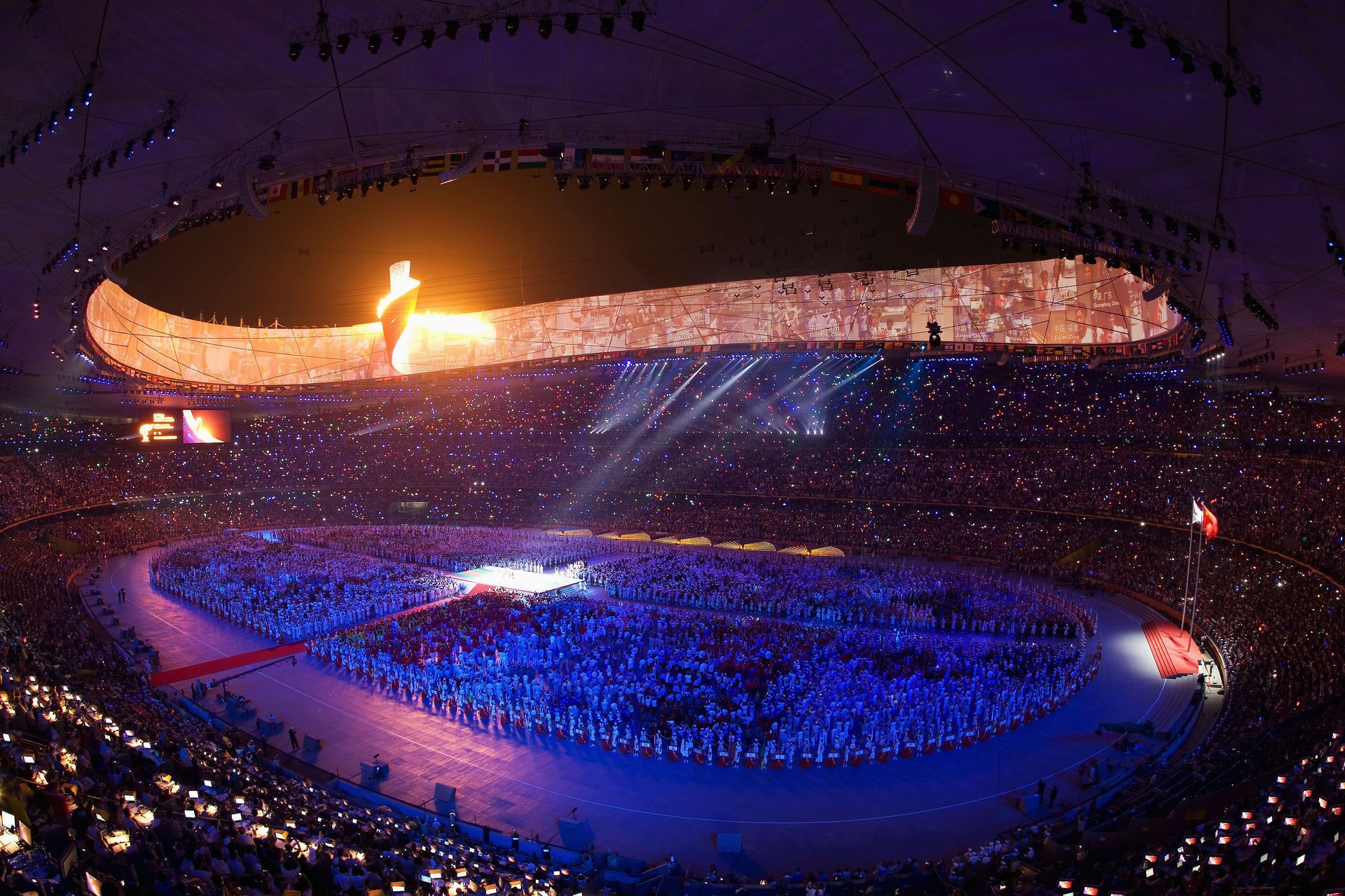 ouverture des jeux olympiques stade pékin sport jeux olympiques 2011 lumières spectacle projecteurs personnes