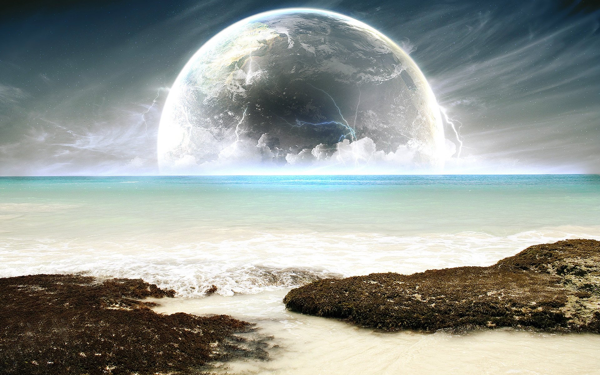 planet the atmosphere zipper clouds the ocean water shore horizon sea surf stones coast wave landscape