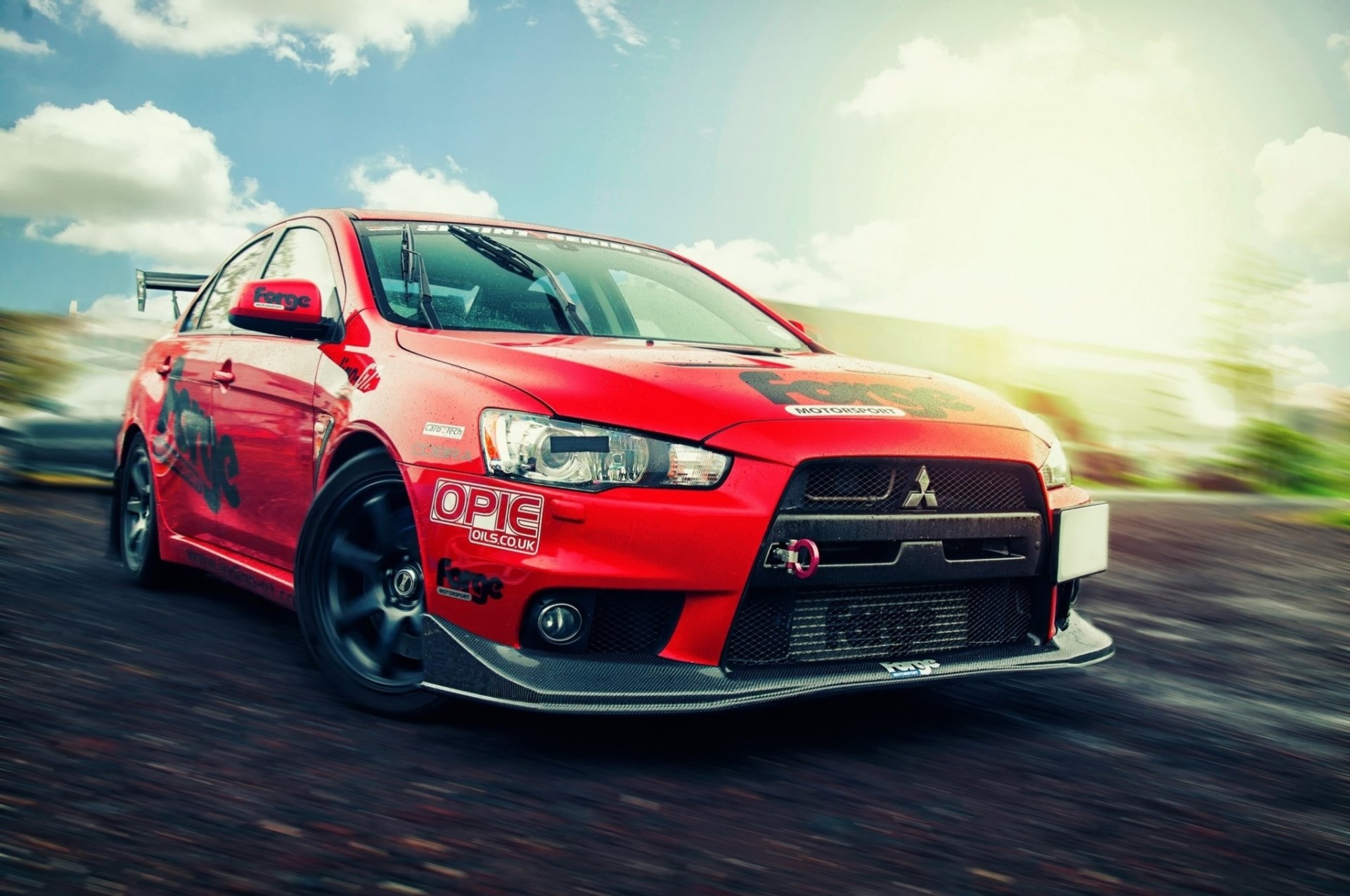 spoiler mitsubishi carretilla nubes llantas resplandor cielo carretera coche faros auto parachoques rojo