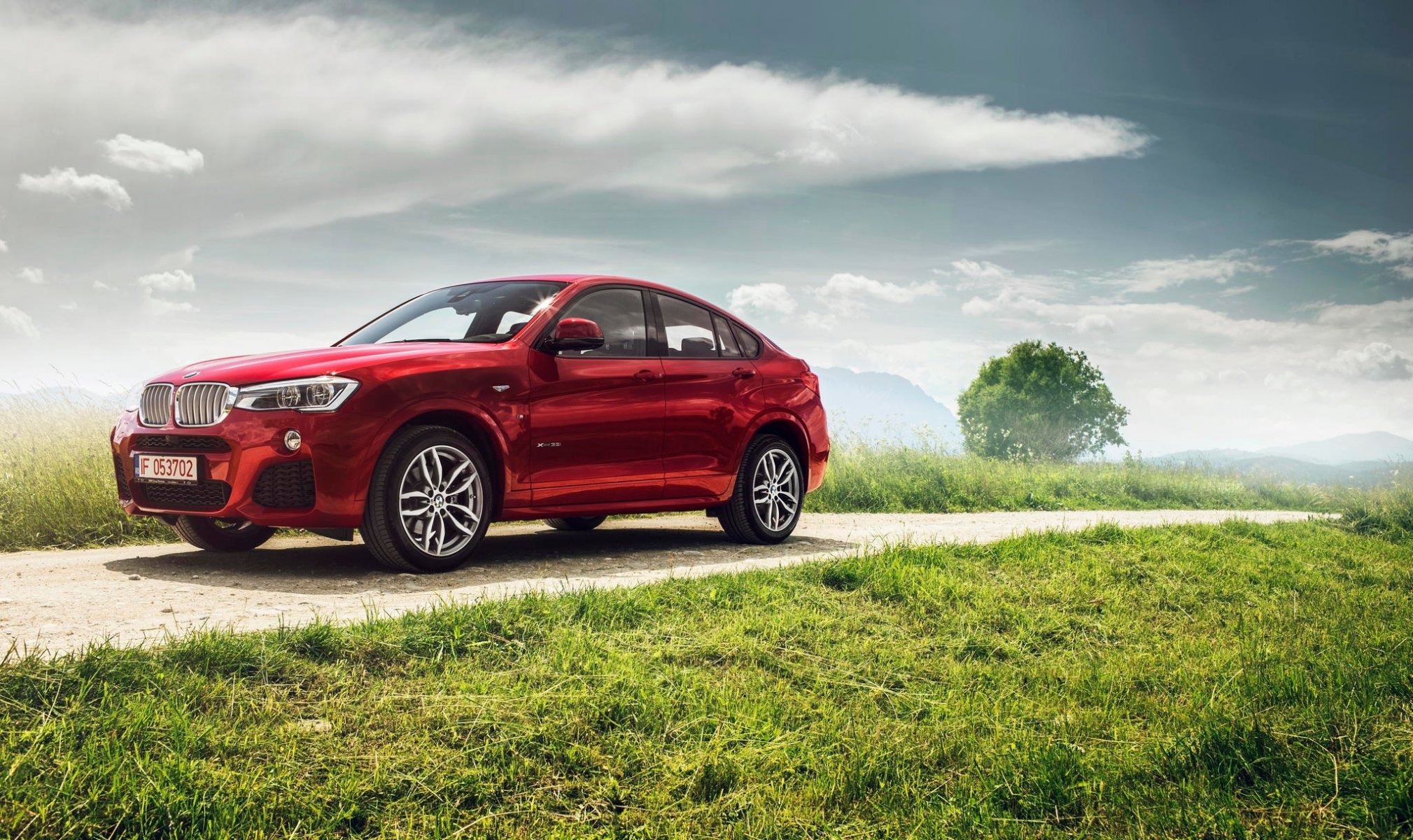 bmw x4 xdrive35i sports package m f26 red ciprian mihai bmw red grass sky