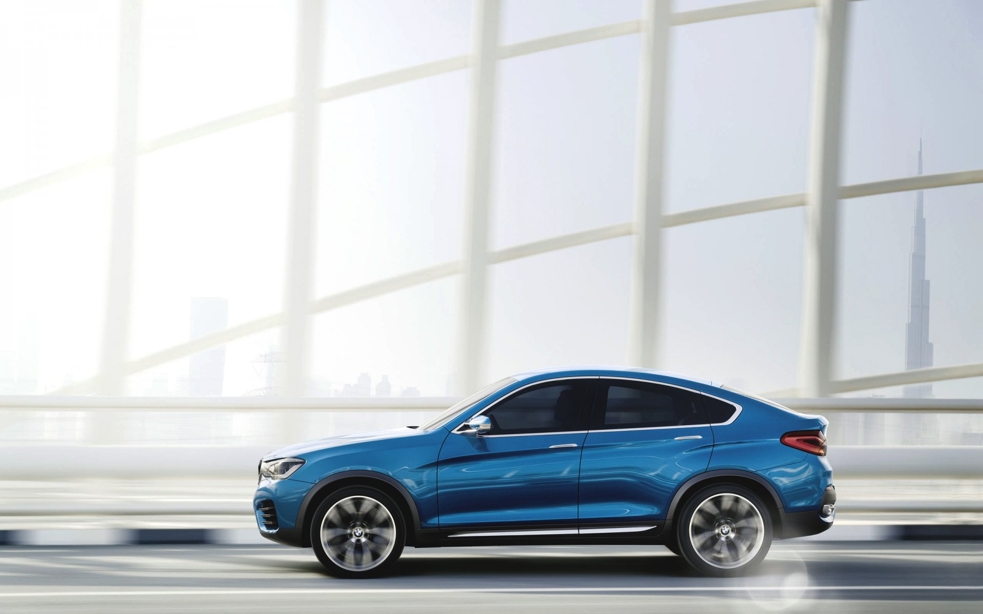 bmw x4 concetto auto blu vista laterale giorno in movimento jeep auto città dubai bmw boomer auto