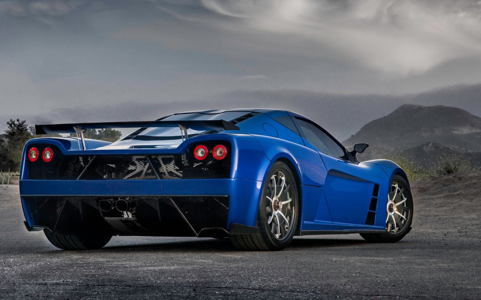 kepler motion motion supercar blue rear view mountains sky