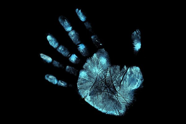 Glowing hand with prints in neon light