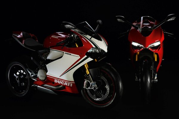 Two stylish cool bikes on a black background