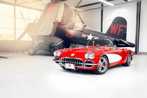 Chevrolet Corvette 1959 on the background of a carrier-based fighter