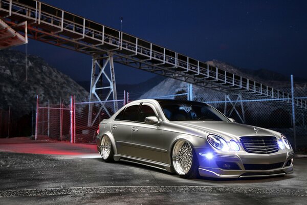 The tuned Mercedes is under the bridge