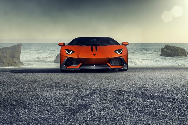 Orange Lamborghini aventador Ip740-4 on the background of the sea