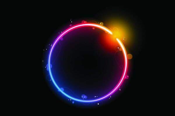 Cercle composé de couleurs arc-en-ciel sur fond noir