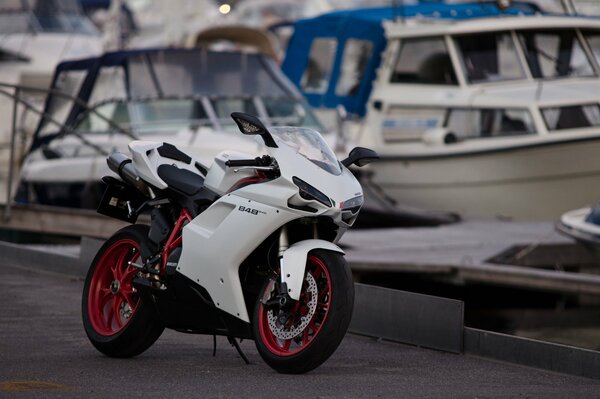 White ducati 848 motorbike at the pier