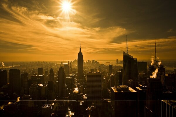 Skyscrapers in New York. The sun. Sepia