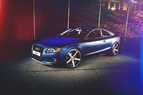 Blue Audi brand car side view