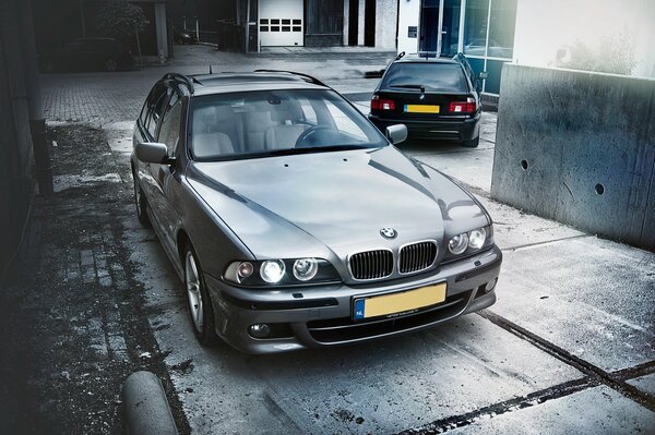 BMW e39 with front headlights and with BMW behind it