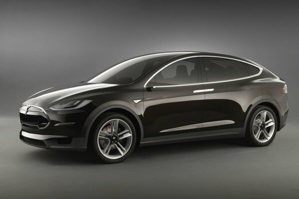 Glossy black Tesla on a gray background, electric car